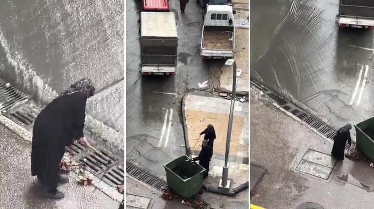 İstanbul’dan yürek ısıtan görüntü! Taşkın oluşmaması için bastonu ile mazgaldaki yaprakları temizledi